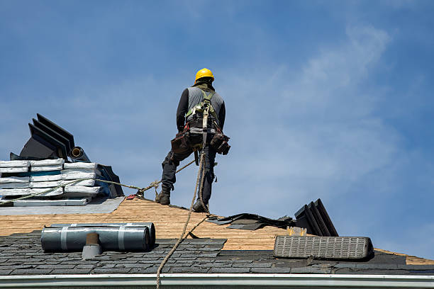 Professional Storm Damage Roof Repair technician working in Leverett, MA